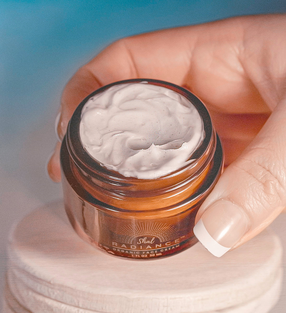 organic beef tallow for skin and face by shal radiance held in a hand 2copy.jpg