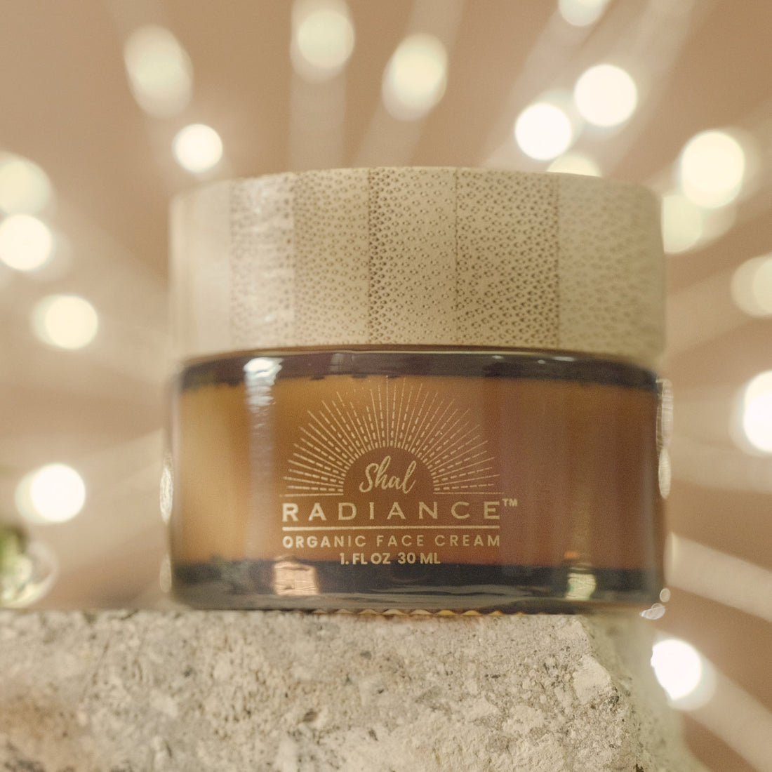 Shal Radiance unscented tallow balm in a 1 fl oz amber glass jar with bamboo lid